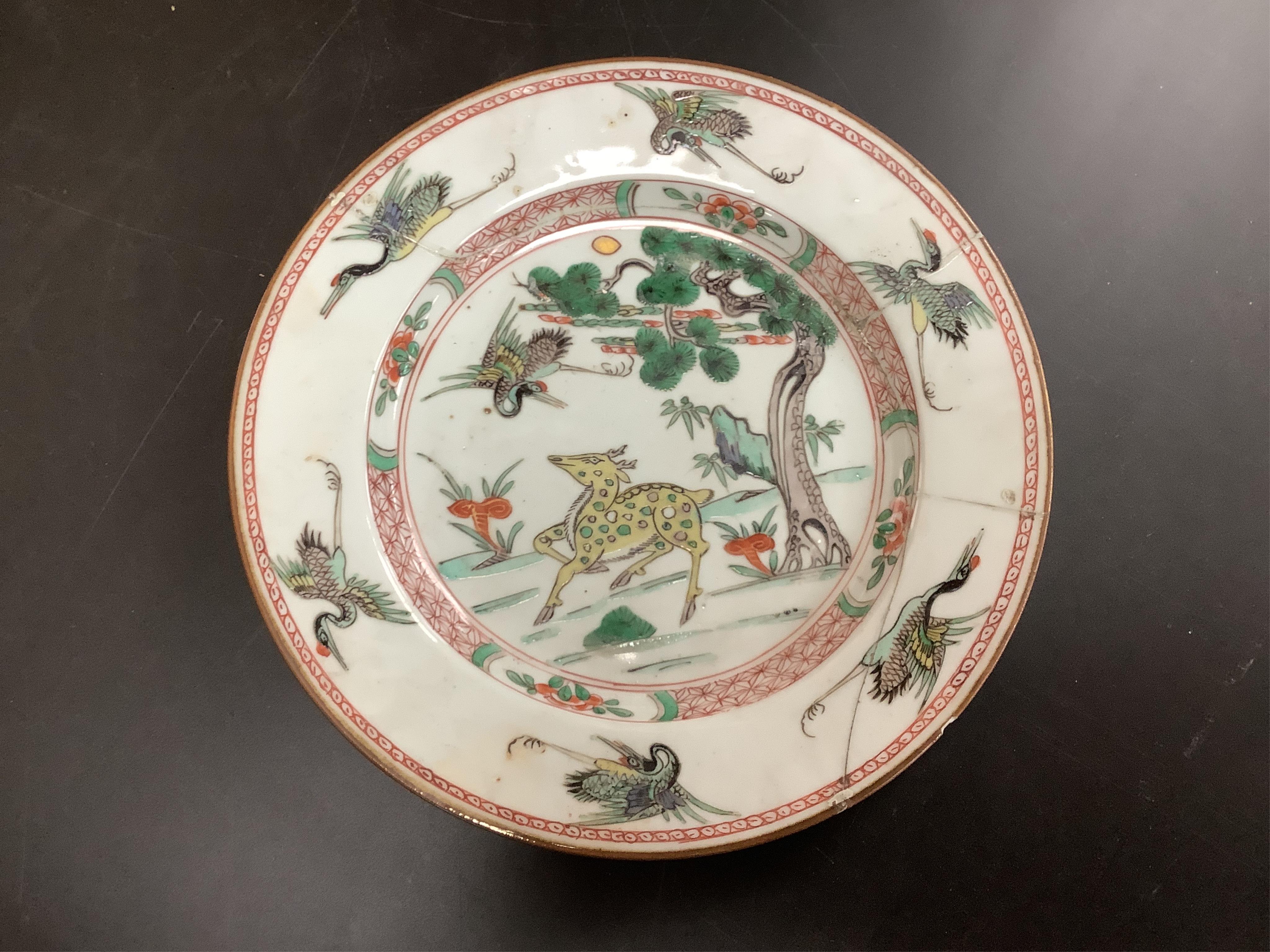 Three Chinese famille verte deer and crane plates, Kangxi period, 22cm in diameter
